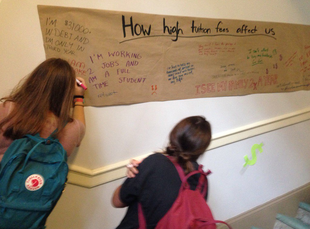 Students at the University of King's College in Halifax write on the campus walls in protest of tuition increases. 