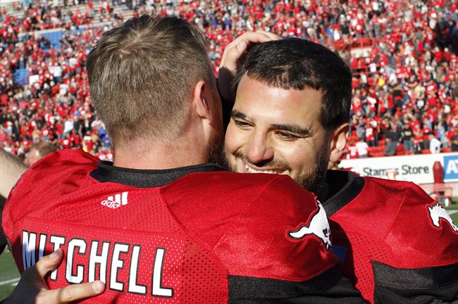 Calgary Stampeders' kicker Rene Paredes, right, celebrates with quarterback Bo Levi Mitchell after kicking a field goal to defeat the Winnipeg Blue Bombers on Saturday.