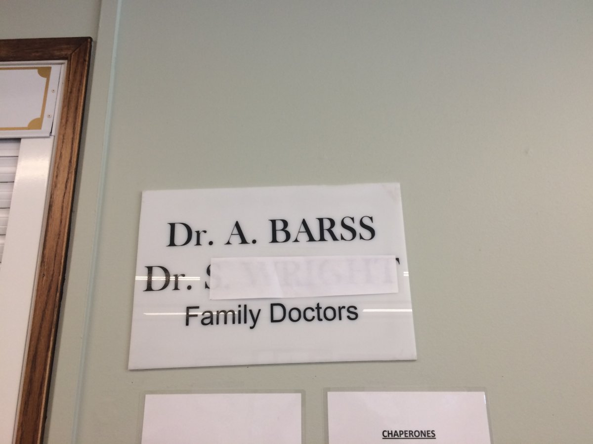 A sign in the Lumby Health Centre shows one doctor's name blocked out. The community is down to one family physician after one doctor retired and another moved their practice to Vernon.  