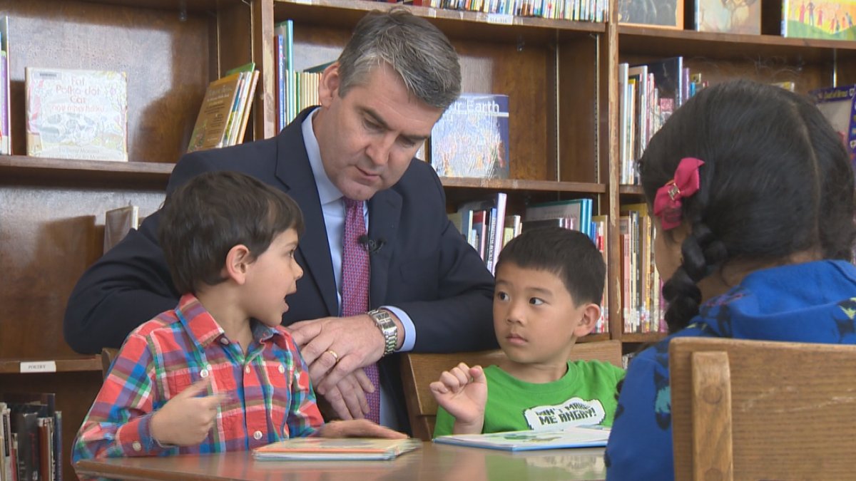Nova Scotia premier Stephen McNeil chats with students at an event on April 20, 2016. The government is waiting to see how teachers vote on a tentative agreement on October 4.