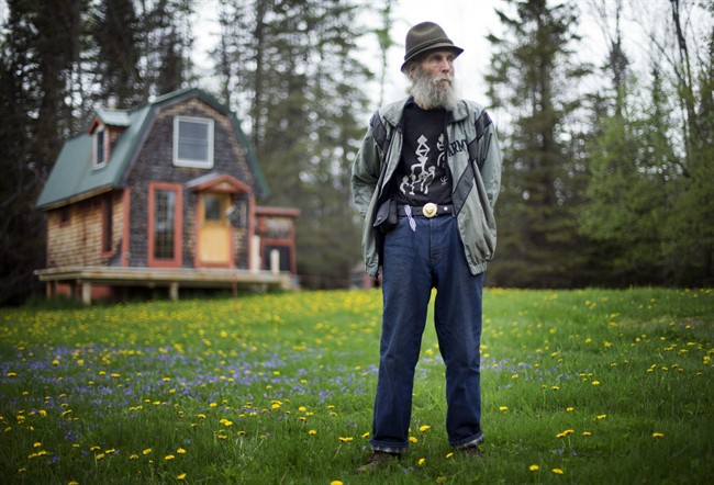 In this Friday, May 23, 2014 file photo, Burt Shavitz, co-founder of Burt's Bees, poses on his property in Parkman, Maine.