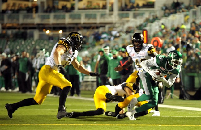 Saskatchewan Roughriders wide receiver Caleb Holley fights his way toward the goal line against the Hamilton Tiger Cats during first half CFL action in Regina on Saturday, September 24, 2016.