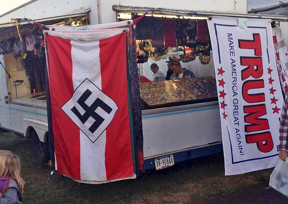This photo provided by Edward Conner shows a Nazi flag displayed for purchase on a merchandise vendor's trailer Saturday, Sept. 24, 2016, at the Bloomsburg Fair fairgrounds in Bloomsburg, Pa.