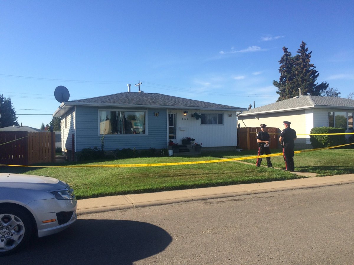 Police tape surrounding a north Edmonton home at 6503 137 Ave., where several police officers could be seen investigating Friday morning. September 16, 2016.