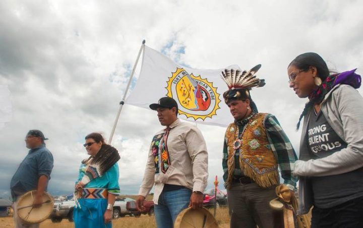 A group from the Saginaw Chippewa Reservation in Mount Pleasant, Michigan wait to raise the reservation's flag after entering an encampment where hundreds of protestors have gathered on the banks of the Cannon Ball River to stop construction of the Energy Transfer Partners' Dakota Access oil pipeline near the Standing Rock Sioux reservation in Cannon Ball, North Dakota, U.S.. September 7, 2016. Protesters have been told to leave, and threatened with prosecution if they don't.