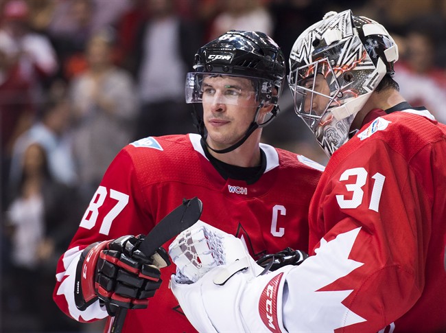 Team Canada captain Sidney Crosby (87) and Canada goalie Carey Price (31) celebrate after defeating Team Czech Republic during third period World Cup of Hockey action in Toronto on Saturday, September 17, 2016. 