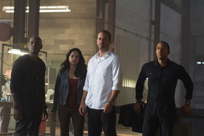 The photo provided by Universal Pictures shows, from left, Tyrese Gibson as Roman, Michelle Rodriguez as Letty, Paul Walker as Brian, and Chris "Ludacris" Bridges as Tej, in the film, "Furious 7," directed by James Wan. The appeal of the ‚ÄúFast and Furious‚Äù franchise, which released its seventh installment in 2015, has long been based on both high-octane races and a much varied cast.