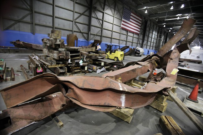 In this Wednesday, March 23, 2011 file photo, twisted beams and other remains from the attacks at the World Trade Center sit in Hangar 17 at New York's John F. Kennedy International Airport.