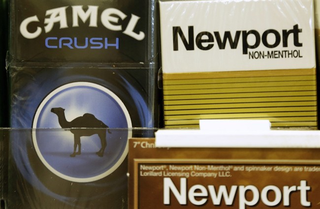 FILE - In this Tuesday, July 15, 2014, file photo, Camel and Newport cigarettes are displayed for sale in Doral, Fla. 