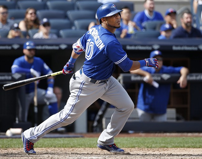 Toronto Blue Jays' Edwin Encarnacion hits a two-run single during the seventh inning of a baseball game in New York, Monday, Sept. 5, 2016. (AP Photo/Kathy Willens).