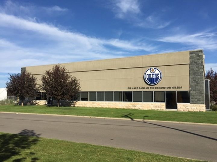 The Edmonton Oilers logo goes up at MGS Company in Edmonton.