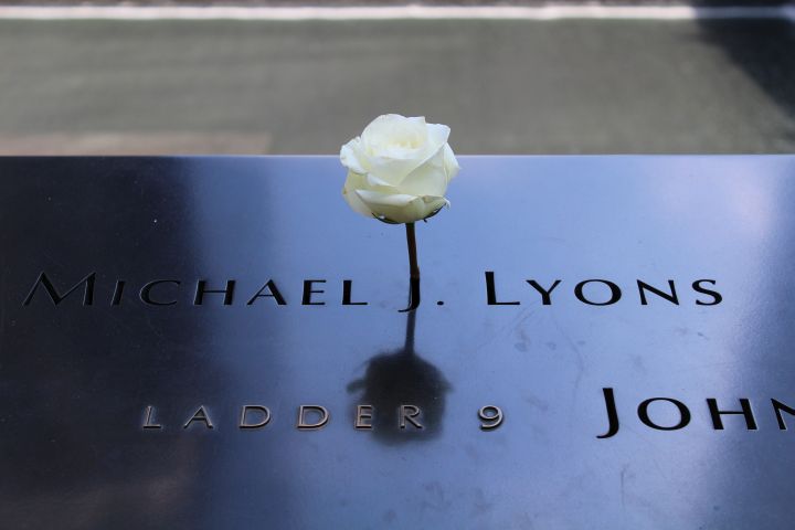 A rose placed on the names of 9/11 victims at the memorial.
