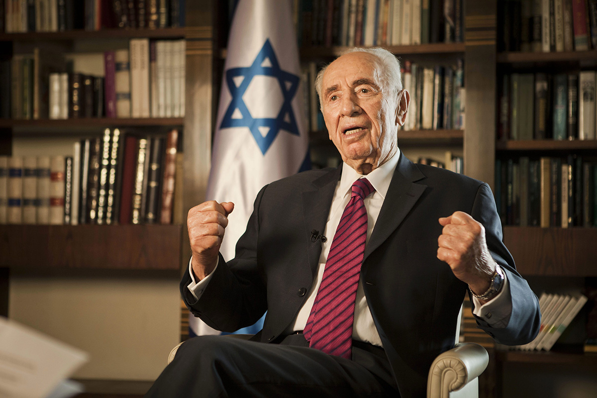 In this Tuesday, July 15, 2014, file photo, Israel's President Shimon Peres speaks during an interview with The Associated Press, at his residence in Jerusalem.