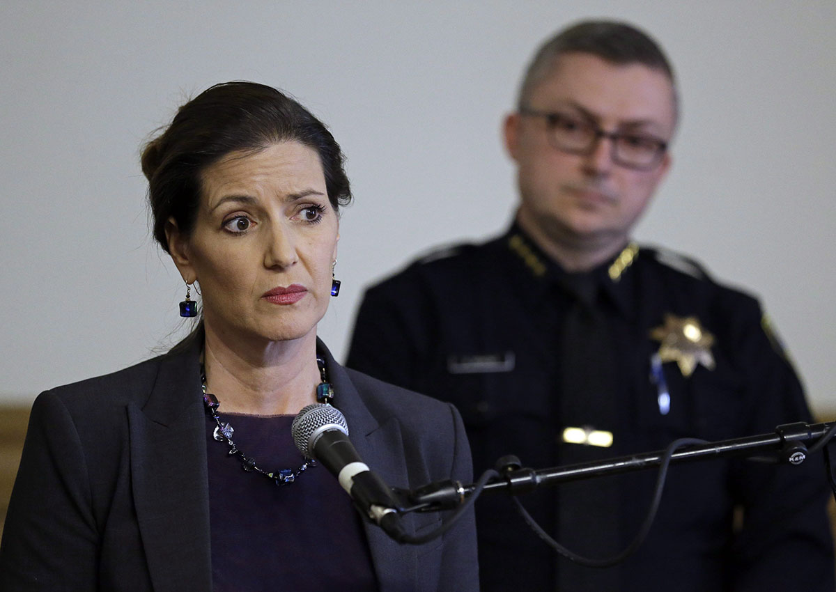 In this May 13, 2016 file photo, Oakland Mayor Libby Schaaf, left, speaks beside then-Oakland Chief of Police Sean Whent in Oakland, Calif. 