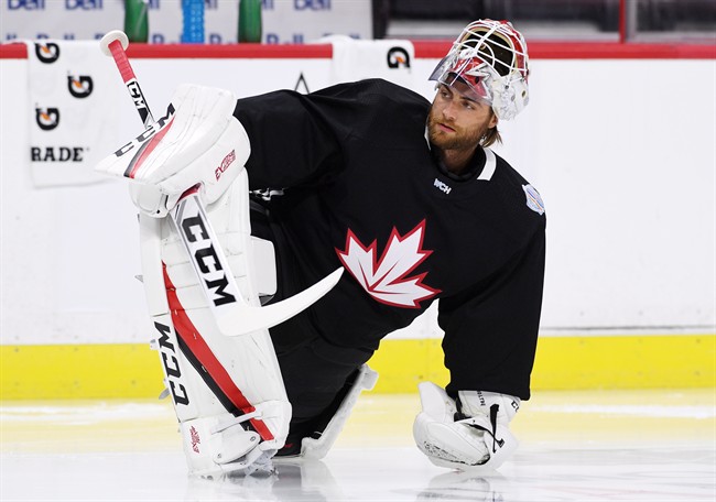 Team Canada's Braden Holtby stretches during practice in Ottawa on Monday, Sept. 5, 2016, in preparation for the World Cup of Hockey.