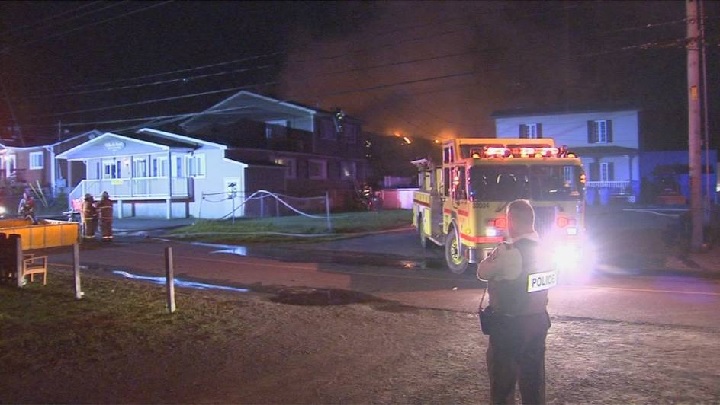 An overnight fire in Sainte-Sophie that started in a garage quickly spread to a nearby seniors' residence forcing the evacuation of all 32 residents. Saturday, Sept. 17, 2016.