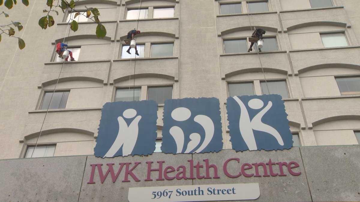 Superheroes are seen washing the windows at the IWK Health Centre in Halifax on Wednesday. 