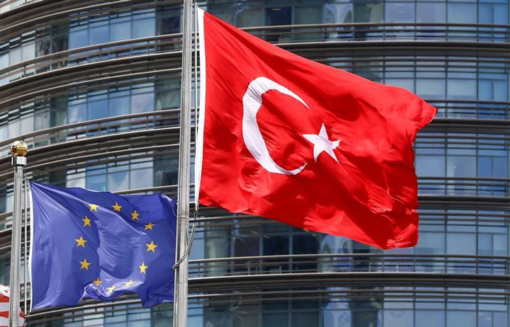 European Union (L) and Turkish flags fly outside a hotel in Istanbul, Turkey May 4, 2016. 
