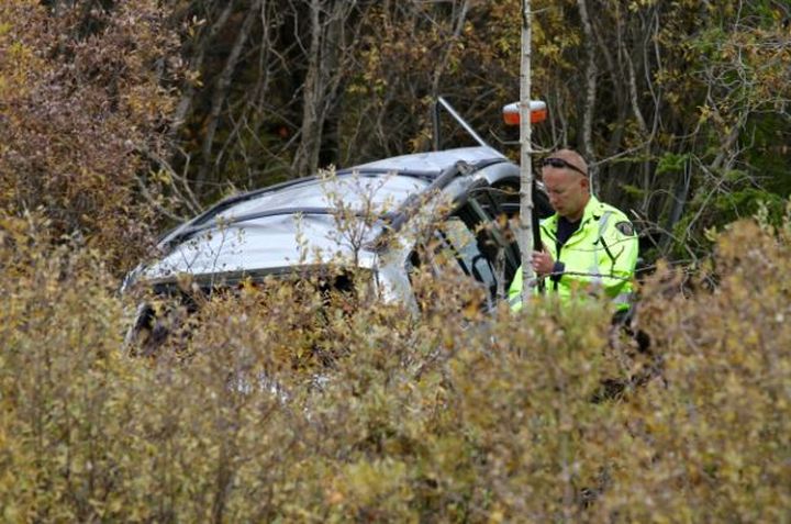 RCMP officer near the SUV involved in a fatal accident near Turner Valley Tuesday morning.