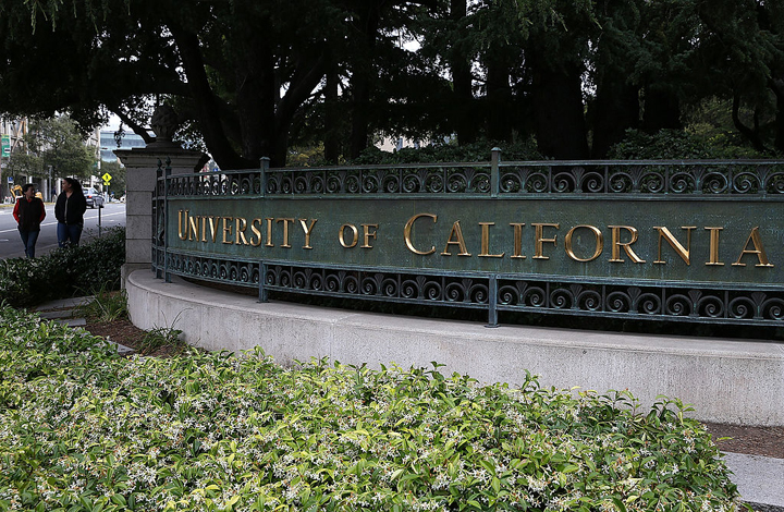 Pedestrians walk by an entrance to the UC Berkeley campus on May 22, 2014 in Berkeley, California.