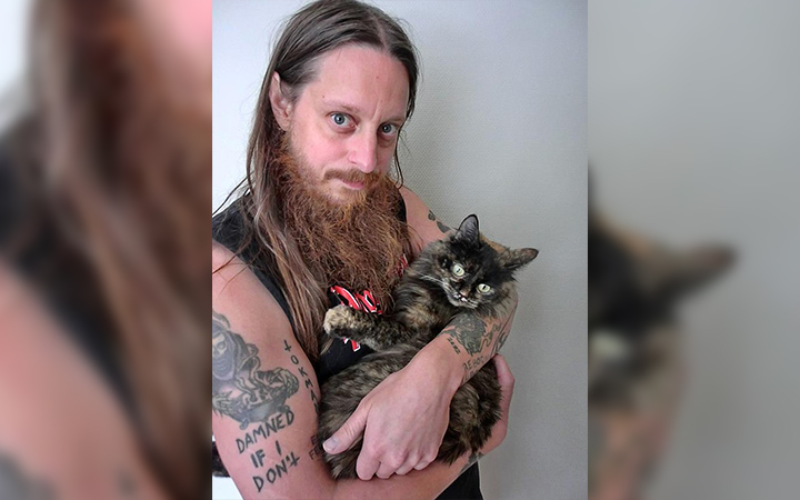 Darkthrone member Gylve “Fenriz” Nagell poses with his cat Peanut Butter.