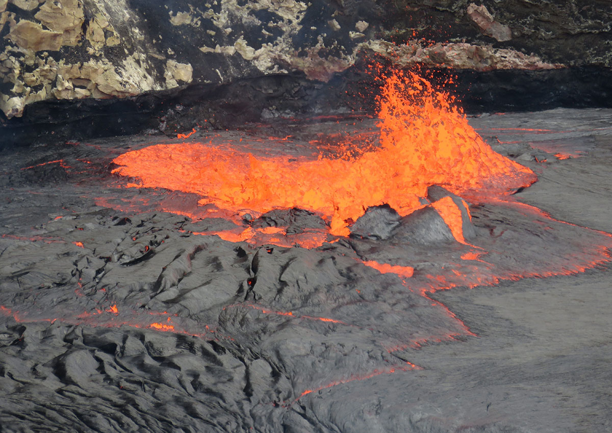In this Sept. 10, 2016, photo released by the U.S. Geological Survey shows the east edge of Halemaumau Crater spattering lava at the south corner of the Kilauea's summit lake.