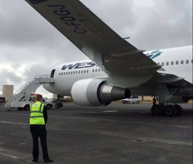 Photo of WestJet flight WS27 on the tarmac at Keflavík International Airport in Reykjavík, Iceland. Saturday, September 10, 2016. 