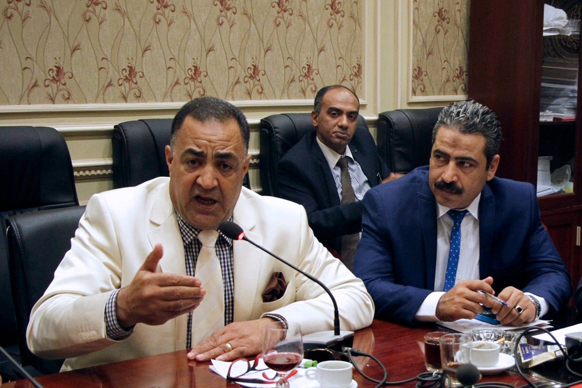In this Sept. 8, 2016, photo, Egyptian Parliamentary member Ilhami Agena, left, attends the human rights committee in Cairo, Egypt. An independent Egyptian daily says the stateÄôs top womenÄôs advocacy group has filed a complaint with the chief prosecutor against the lawmaker who called for mandatory virginity tests for women seeking university admission.