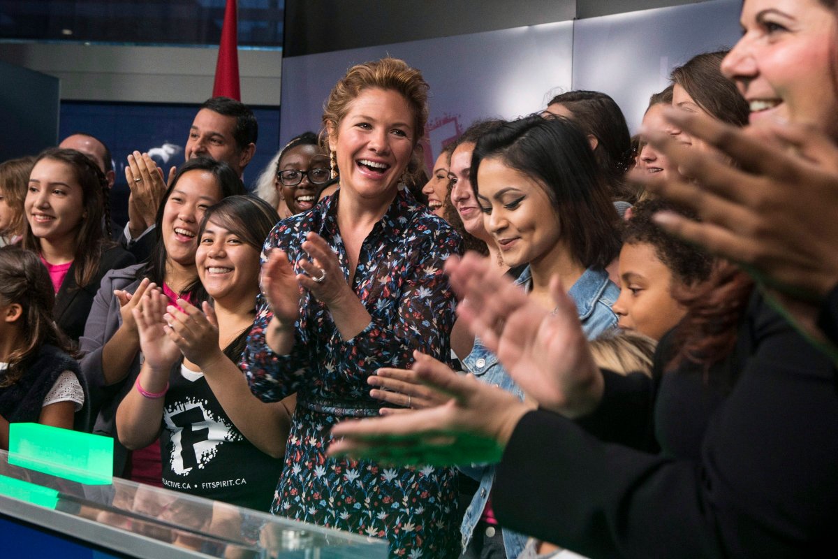 Sophie Gregoire Trudeau, centre, stands with girls representing G(girls)20 FitSpirit/Fillactive and Plan International Canada after opening the market at the TSX in Toronto to celebrate International Day of the Girl, on Tuesday October 11, 2016. 