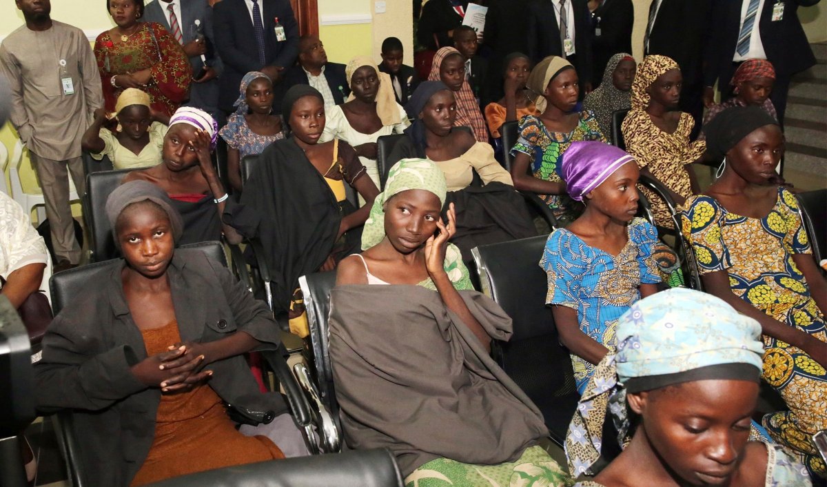In this photo released by the Nigeria State House, freed Chibok school girls sit during a meeting with Nigeria Vice President Yemi Osinbajo, in Abuja,, Nigeria, Thursday, Oct. 13, 2016. Twenty-one of the Chibok schoolgirls kidnapped by Boko Haram more than two years ago were freed Thursday in a swap for detained leaders of the Islamic extremist group Äî the first release since nearly 300 girls were taken captive in a case that provoked international outrage. 