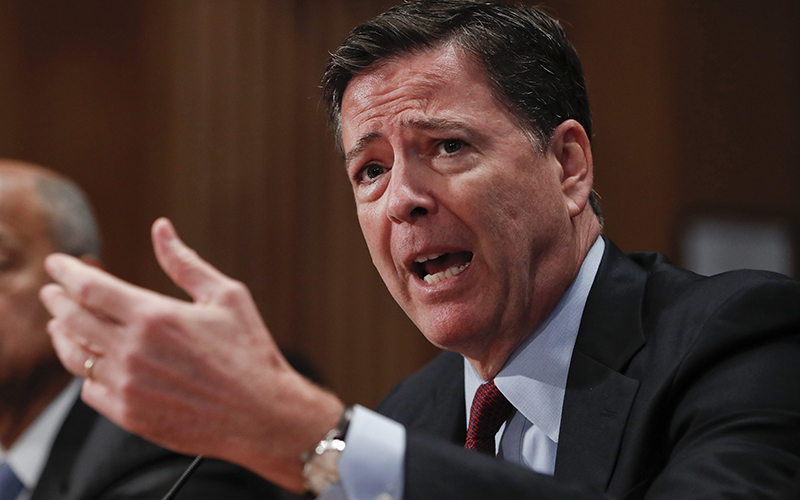 FBI Director James Comey testifies on Capitol Hill in Washington. The longtime Hillary Clinton aide at the center of a renewed FBI email investigation testified under oath four months ago she never deleted old emails, despite promising in 2013 not to take sensitive files when she left the State Department.  