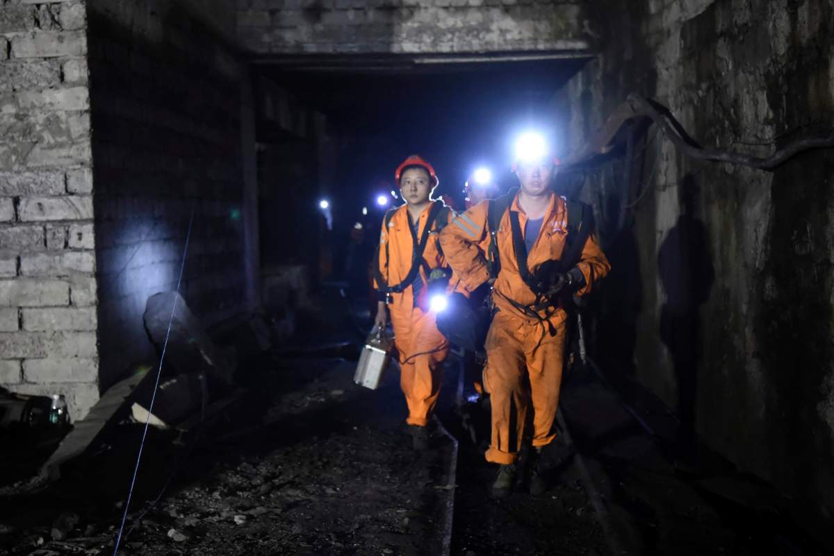 In this Monday, Oct. 31, 2016 photo released by China's Xinhua News Agency, rescuers work at Jinshangou Coal Mine in Chongqing, southwest China. Rescuers worked through the night at the privately owned Jinshangou mine where the explosion occurred before noon Monday, Xinhua News Agency reported. 