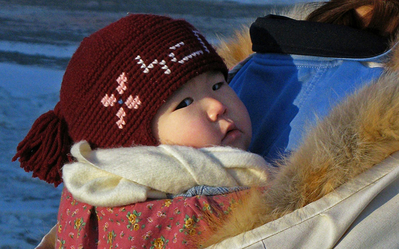 An Inuit baby is carried in a papoose in the northern Labrador community  of Nain, N.L.