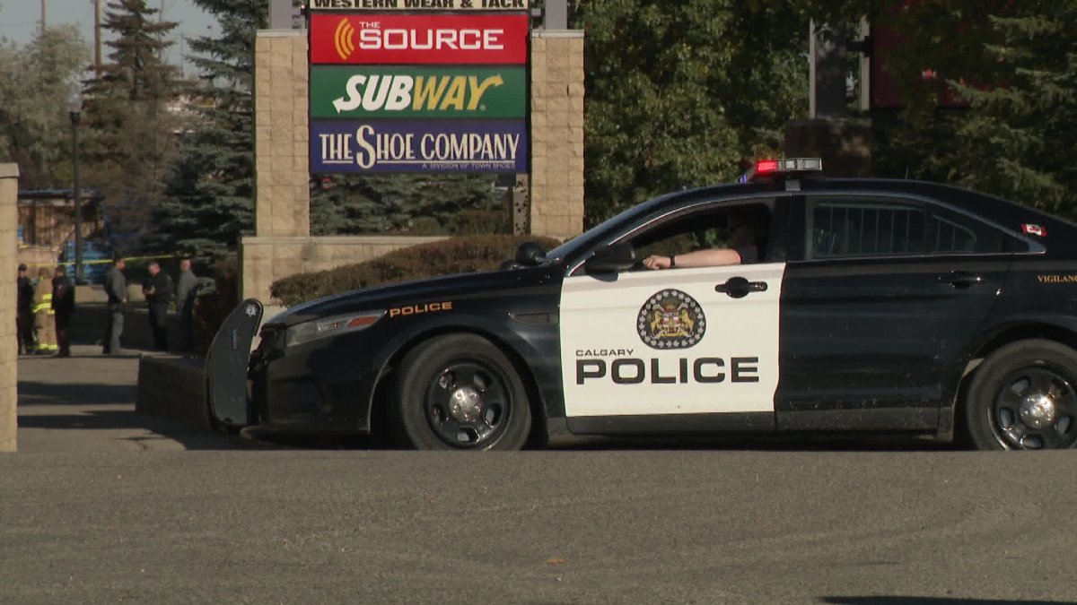 Police at the scene of a bomb scare at Shawnessy strip mall Sunday.