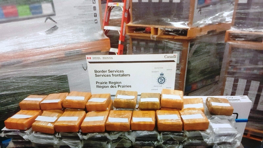 The Canada Border Services Agency, along with RCMP, show cocaine seized during a drug importation investigation at the Coutts border crossing that focused on commercial vehicles.