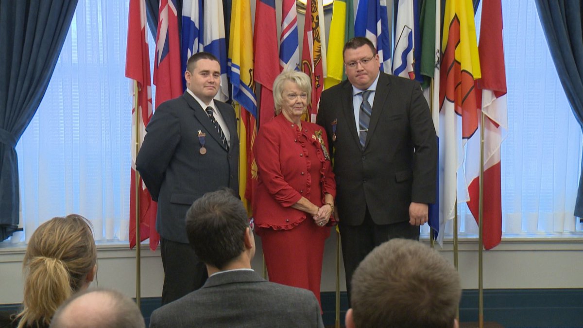 Kalvin Jones and Darryl Morin receive bronze medal of bravery from Lieutenant Governor.