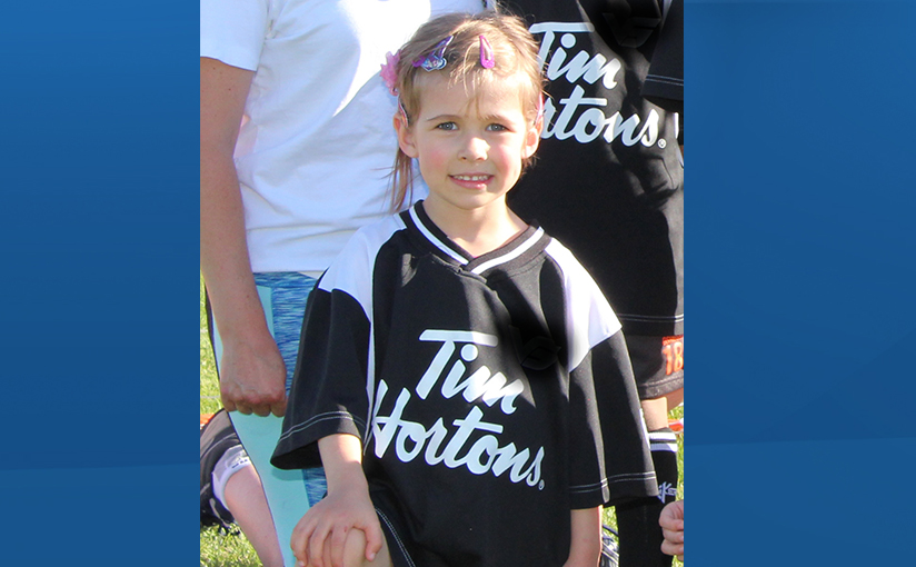 Camryn, Jill Officer's four year old daughter poses for a photo with her soccer team. 