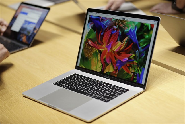 MacBook computers are shown in a demo room following the announcement of new products at Apple headquarters Thursday, Oct. 27, 2016, in Cupertino, Calif.