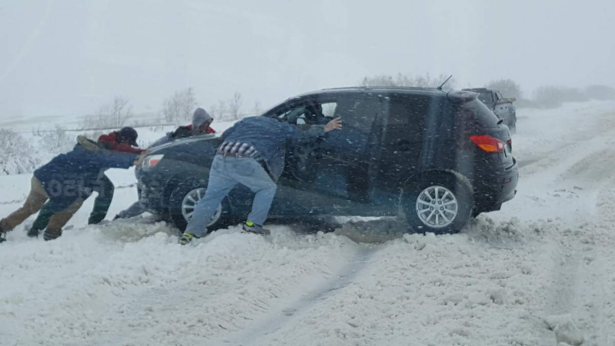 Cars stuck in snow near Melfort.