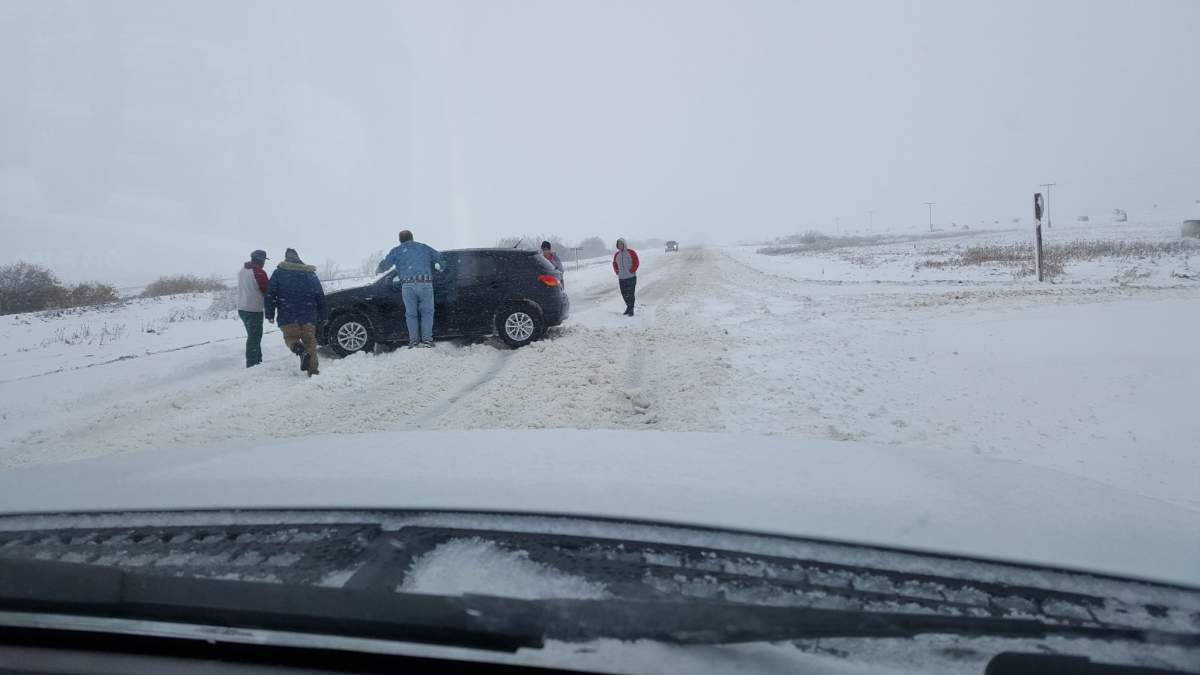 Cars stuck in snow near Melfort.