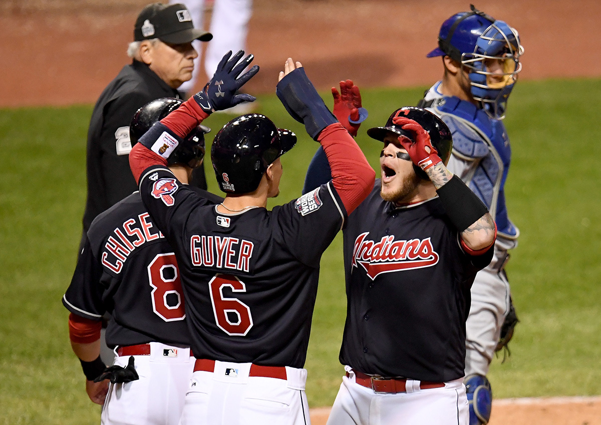 Roberto Perez of the Cleveland Indians celebrates with Lonnie Chisenhall and Brandon Guye after hitting a three-run home run during the eighth inning.
