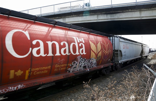 A Canadian Pacific Rail train hauling grain passes through Calgary, Thursday, May 1, 2014. 