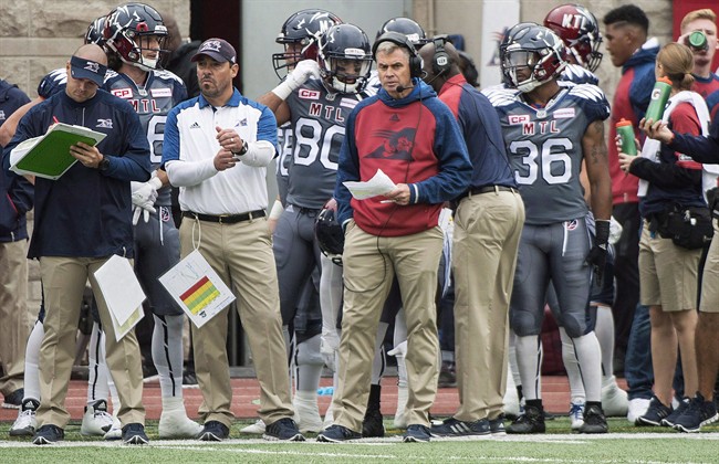 Montreal Alouettes head coach Jacques Chapdelaine, centre, looks on from the sideline during first half CFL football action in Montreal in an October 2, 2016, file photo. The Als have not won twice in a row this season and are hoping the jolt of promoting Jacques Chapdelaine to head coach will last at least another week as they face the Edmonton Eskimos. 