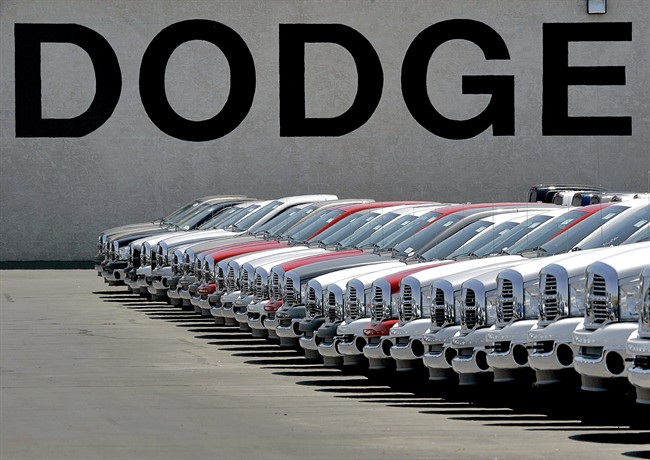 A row of new Dodge Ram pickup trucks are shown Tuesday, May 15, 2007 at a dealership in Mesa, Ariz. 