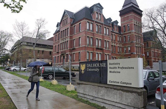A pedestrian walks by a Dalhousie building in Halifax on Friday, May 22, 2015.