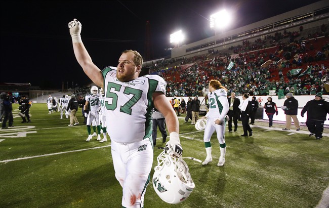 Saskatchewan Roughriders' Brendon LaBatte celebrates wining the CFL West Final in Calgary, Alta., Sunday, Nov. 17, 2013. The Roughriders signed veteran offensive lineman LaBatte to a contract extension through the 2017 season Monday.
