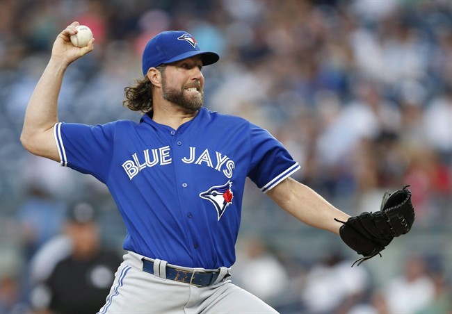 Toronto Blue Jays starting pitcher R.A. Dickey throws during the first inning of a baseball game against the New York Yankees in New York, Monday, Aug. 15, 2016. 