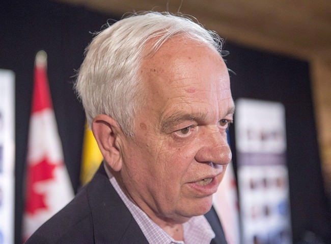 Immigration Minister John McCallum talks with reporters at a meeting of Atlantic Canada's four premiers and federal ministers at the farm of Lawrence MacAulay, MP for Cardigan, in St. Peters Bay, P.E.I. on Monday, July 4, 2016.