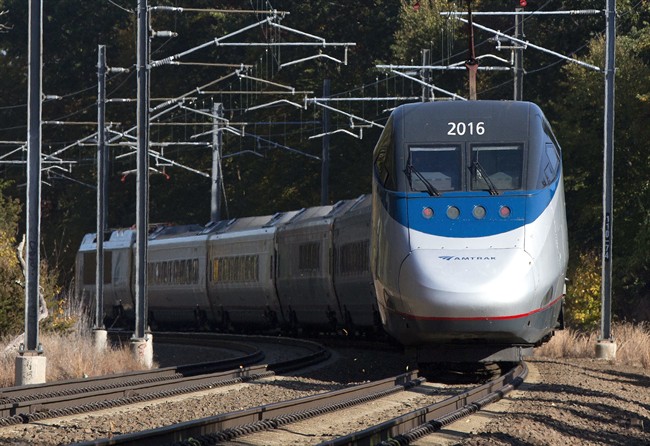 In this Tuesday, Oct. 18, 2016 photo, an Amtrak Acela train travels through Old Lyme, Conn. A plan to speed up Amtrak's high-speed rail corridor from Boston to Washington, D.C., is welcomed by business commuters but finding its strongest opposition in some shoreline towns in Connecticut. (AP Photo/Michael Dwyer).