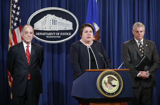 Assistant Attorney General Leslie R. Caldwell, center, of the Criminal Division; Kenneth Magidson, left, of the Southern District of Texas; and Bruce M. Foucart, director, National Intellectual Property Rights Coordination Center, participate in a news conference at the Justice Department in Washington, Thursday, Oct. 27, 2016.